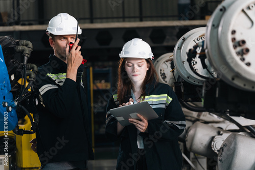 Canvas-taulu Repair specialist inspects machinery in factory ensuring industry standards are