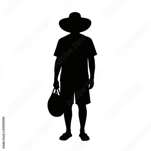 Silhouette of a Person Wearing Hat and Holding Bag.