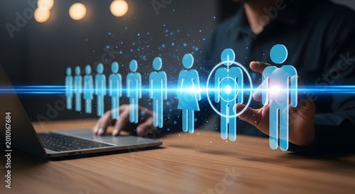 A person interacting with a digital projection of human figures, highlighting a target individual, symbolizing customer segmentation and audience targeting.