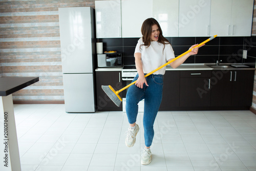 Photos Young woman on kitchen during quarantine