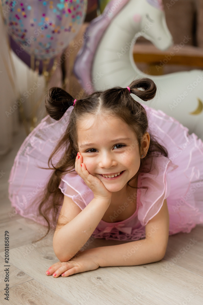 Fototapeta premium Happy little girl in a ballerina costume