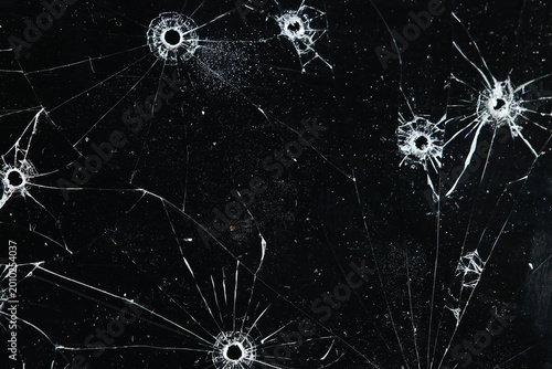 Bullet holes on black glass, overlay design background