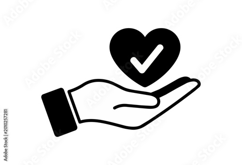 Hand holding check mark icon isolated black background