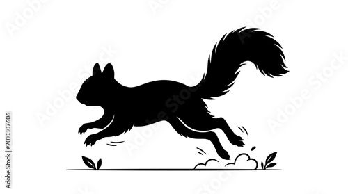 Billede på lærred Silhouette of a running squirrel with a bushy tail and blurred motion