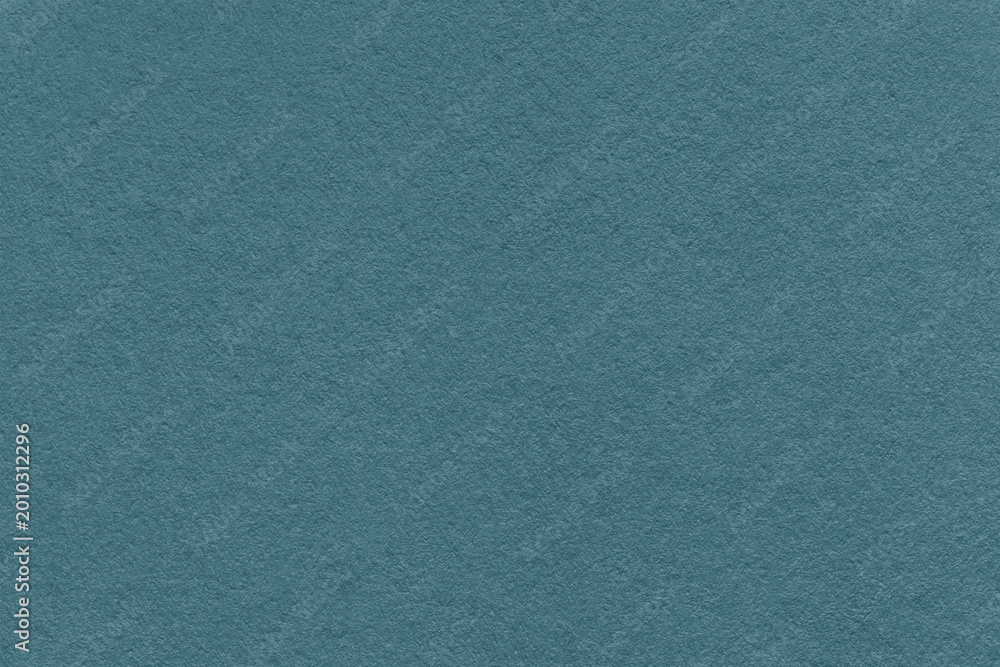 Fototapeta premium Dark teal textured paper background with subtle grain surface and soft structure. Muted teal backdrop, macro