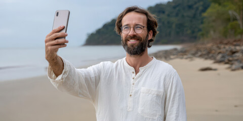 Male influencer taking a selfie on a tropical beach, enjoying vacation with social media content creation