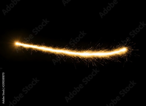 Sparkler trail glowing golden light against a dark background with bokeh effects