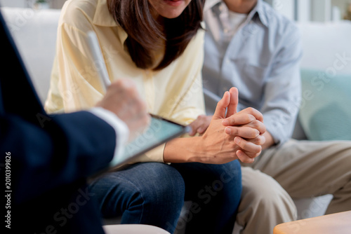 Asian couple therapy counseling and relationship support, mental health, consultation about anxiety, stress and depression, psychologist advising family conflict management, conversation for empathy.