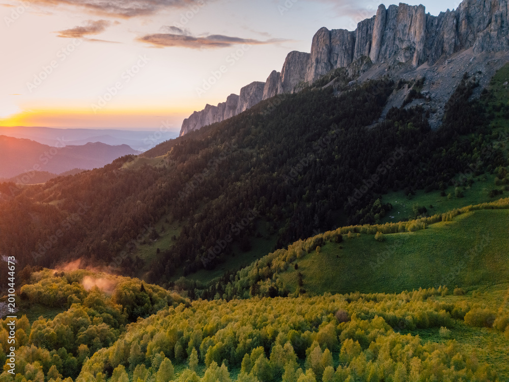 Obraz premium Above drone view of national park Bolshoy Tkhach mountain in Caucasus with sunset sunlight