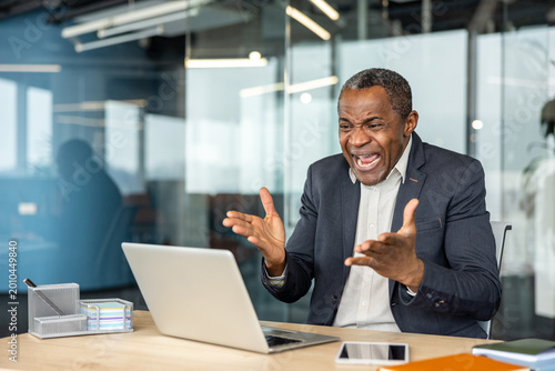 Photography Stressed mature professional man throwing hands up in exasperation and shouting