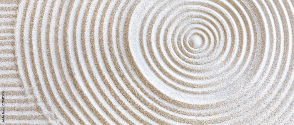 Fototapeta premium Ethereal sand rings ripple outward from a single origin, forming flawless
