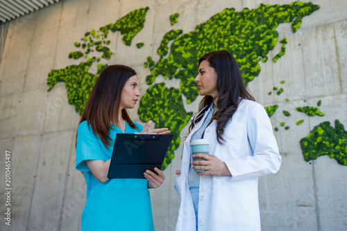 Medical professionals discussing global health and sustainability