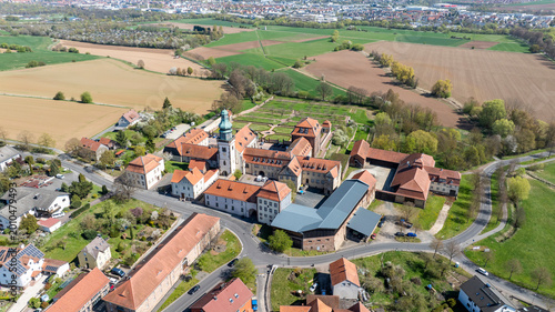 Bild auf Leinwand Aerial View Propstei Johannesberg, , Benedictine priory, district of Fulda in Hesse, Roman Catholic parish church of St
