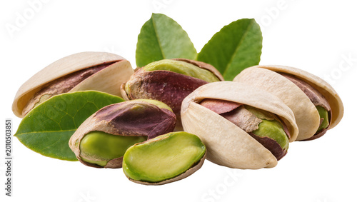 Obraz na plátně Heap of shelled and unshelled pistachios with green leaves, isolated on transpar