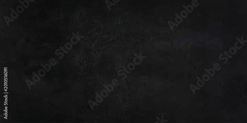 Fotografie A dark vintage chalkboard texture with a black and white grunge pattern on an ol