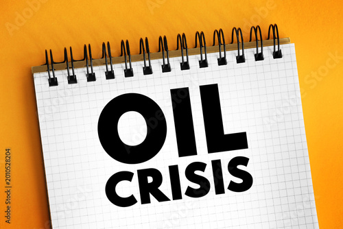 Oil Crisis - a significant and often sudden disruption in the supply of oil, leading to increased prices and economic turmoil, text concept on notepad