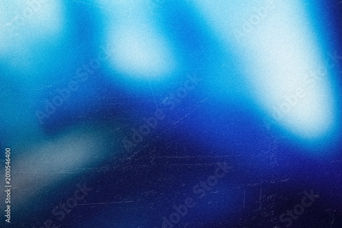 Deep Blue Gradient Light Leak Overlay with Soft Cyan Glow, Vintage Film Grain Texture and Abstract Dark Cinematic Background for Photo Video Effects
