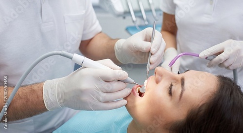 Professional Dental Cleaning Procedure with Ultrasonic Scaler in Modern Clinic