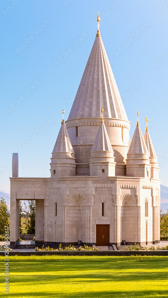Obraz premium Stunning vertical shot of the Yazidi temple Ziarat in Aknalich Armenia with its unique white stone conical domes and spiritual architecture under a clear sky