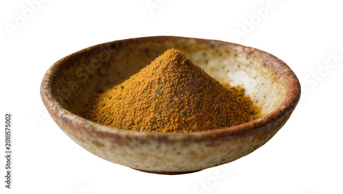 Rustic ceramic bowl filled with golden curry powder, isolated on transparent background