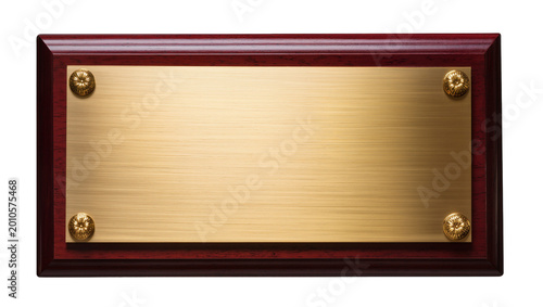 Fotografie Rectangular brass plaque with ornate screws on polished mahogany frame, isolated