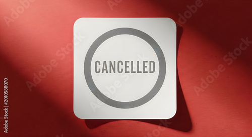 Cancelled stamp on red background with shadow