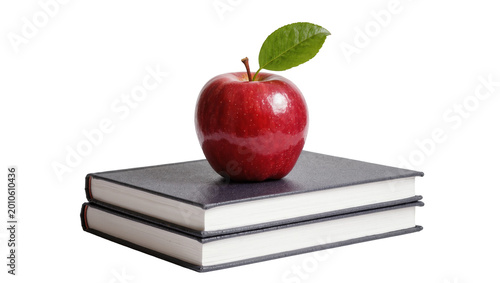 Konstfotografi Red apple atop stacked books with green leaf