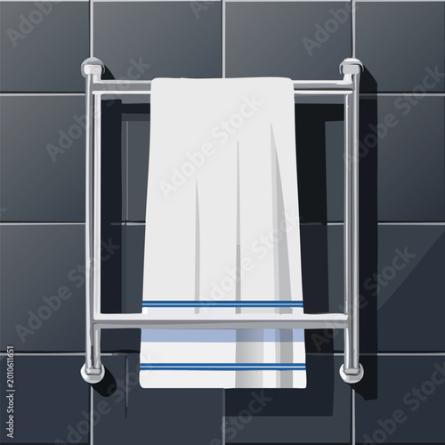Clean white towel hanging on a chrome rack in a bathroom setting