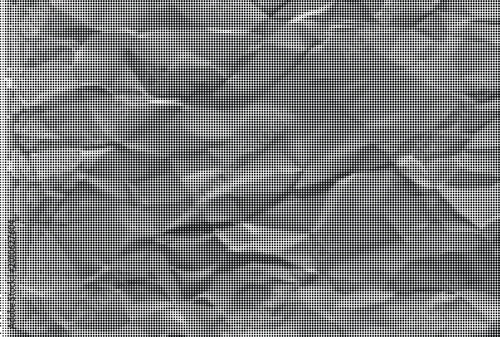 A close-up view of crumpled paper with a highly textured surface