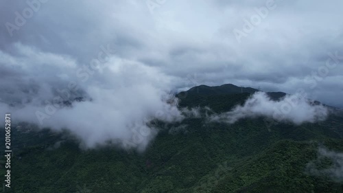 Misty Green Mountain Forest Under Cloudy Sky
