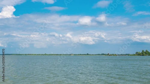 Calm Lake Landscape Under Blue Cloudy Sky