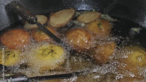 Golden Fritters Deep Frying in Bubbling Hot Oil