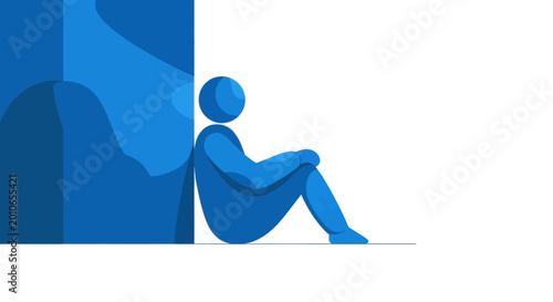 Photos Blue figure sitting alone, leaning against a wall, feeling isolated