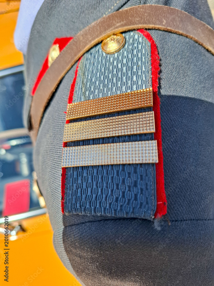 Fototapeta premium VORONEZH, Russia - April 25, 2026.Close view of shoulder boards on vintage Soviet police uniform showing rank details and fabric texture