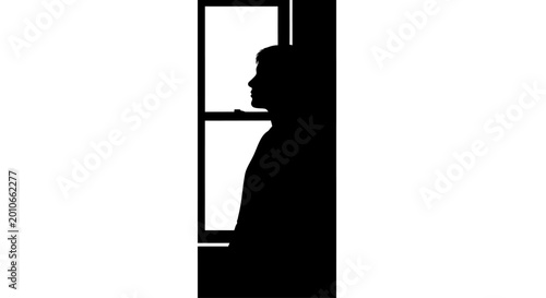 фотографія Silhouette of a lonely person looking through a window.
