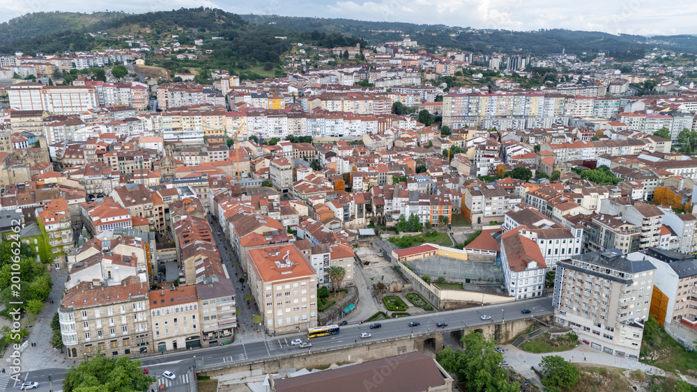 Fototapeta premium Ourense cityscape featuring urban architecture and street traffic