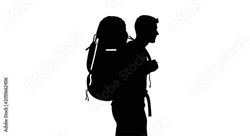 Bild auf Leinwand Silhouette of a man wearing a large hiking backpack.