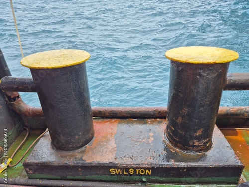 Konstfotografi Close-up of bollards with “SWL 8 TON” marking on a weathered ship deck