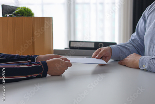 Manager Terminating Employee and Handing Over Severance Document.