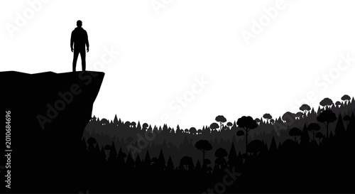 Tableau sur toile A solitary man standing on a cliff edge looking out.