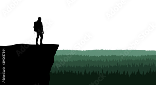 Schilderij op canvas Silhouette of a lone hiker standing on the edge of a cliff.