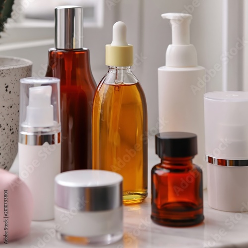 Wellness Products Displayed on a Table With Towels and Stones in a Bright Room