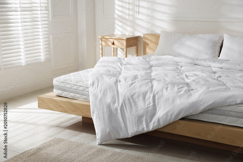 Fototapeta premium Orthopedic mattress, pillows and duvet on bed at home