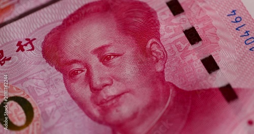 Chinese yuan with a face value of 100 folded together, a large amount of Chinese cash invested together, close up