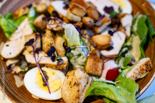 Caesar Salad with crisp romaine lettuce, crunchy croutons, and fresh parmesan cheese, served in a French restaurant