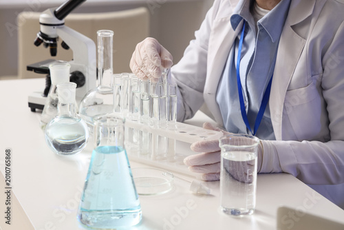Female scientist dropping w...