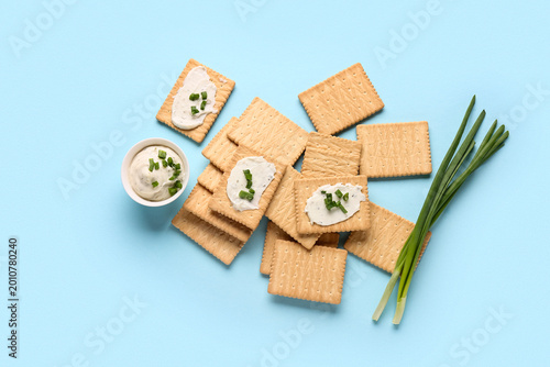 Tasty crackers with bowl of...