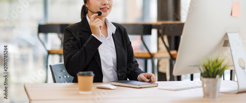 Customer support agent working in a call center office