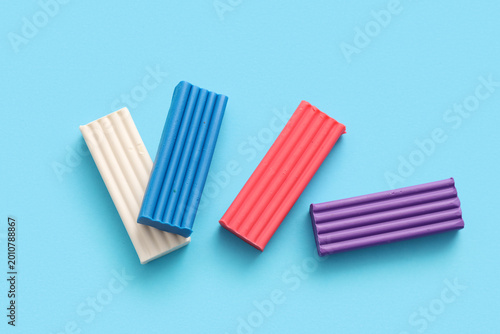 Colorful plasticine on blue...