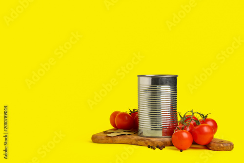 Tin can with tomato paste a...